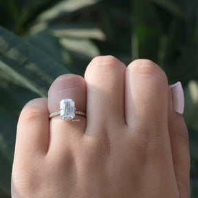 Close-Up View of Emerald Cut Moissanite Ring In Yellow Gold