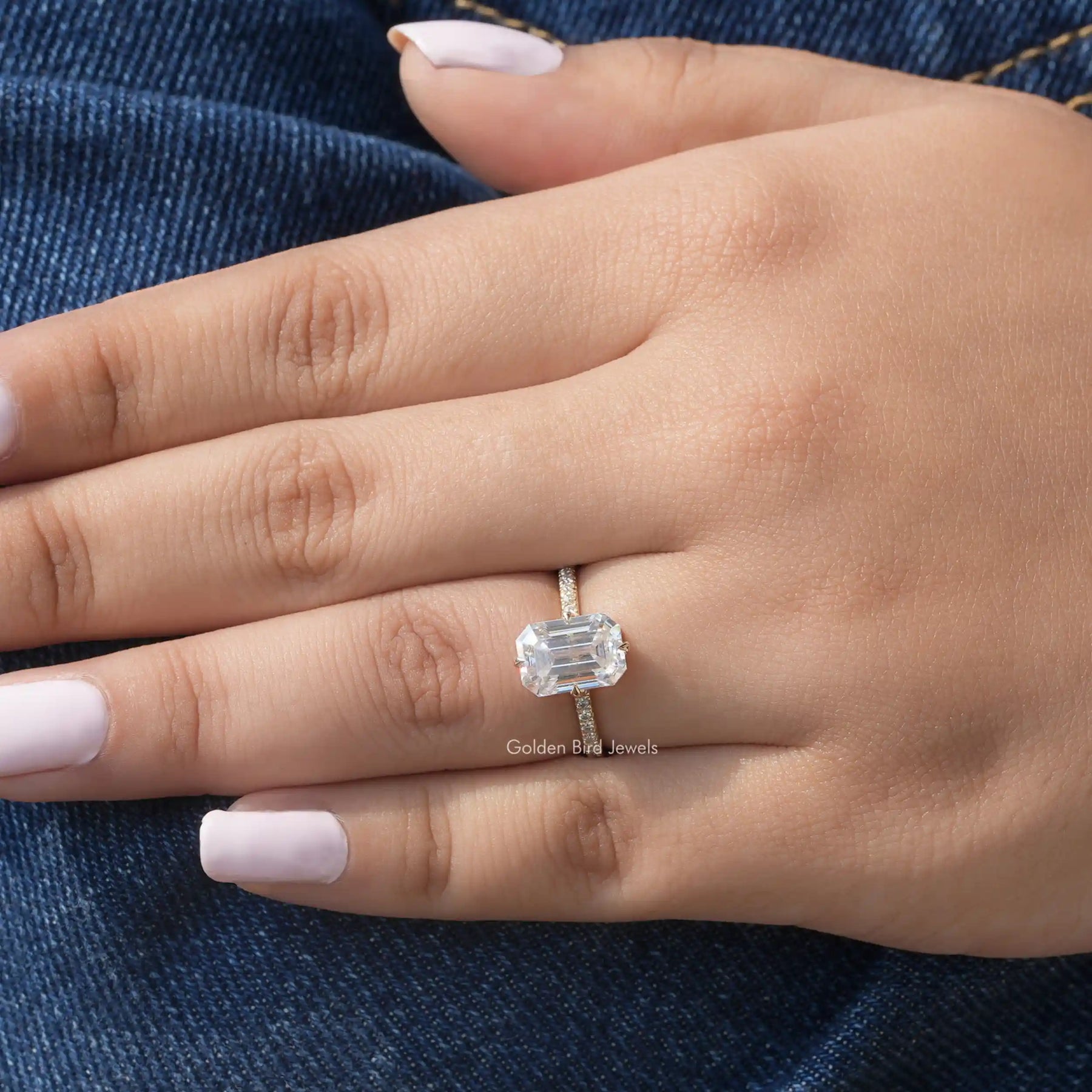 View of Hidden Halo Emerald Cut Moissanite Ring In Yellow Gold