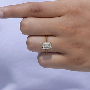 Close-Up View of A White Gold Emerald Shaped Ring in a finger