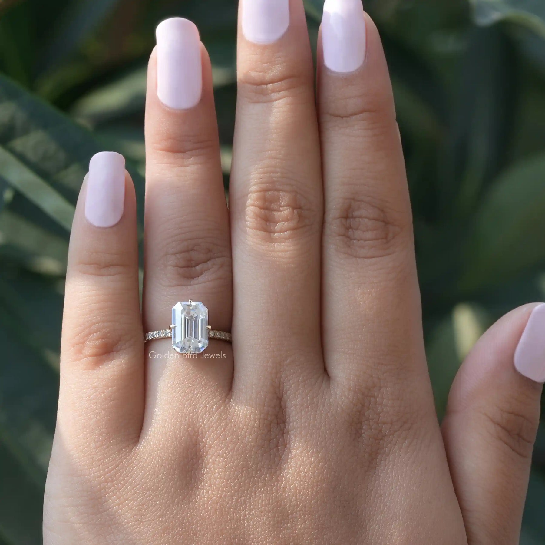 View of Moissanite Emerald Cut Engagement Ring In finger