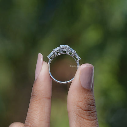 Back View of Emerald And Baguette Cut 5 Stone Diamond Ring In two fingers