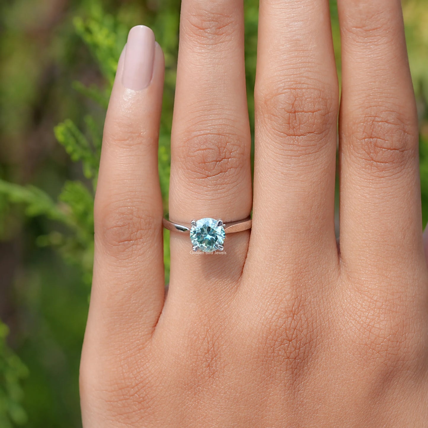 View of  Blue Green Round moissanite Solitaire Ring 
