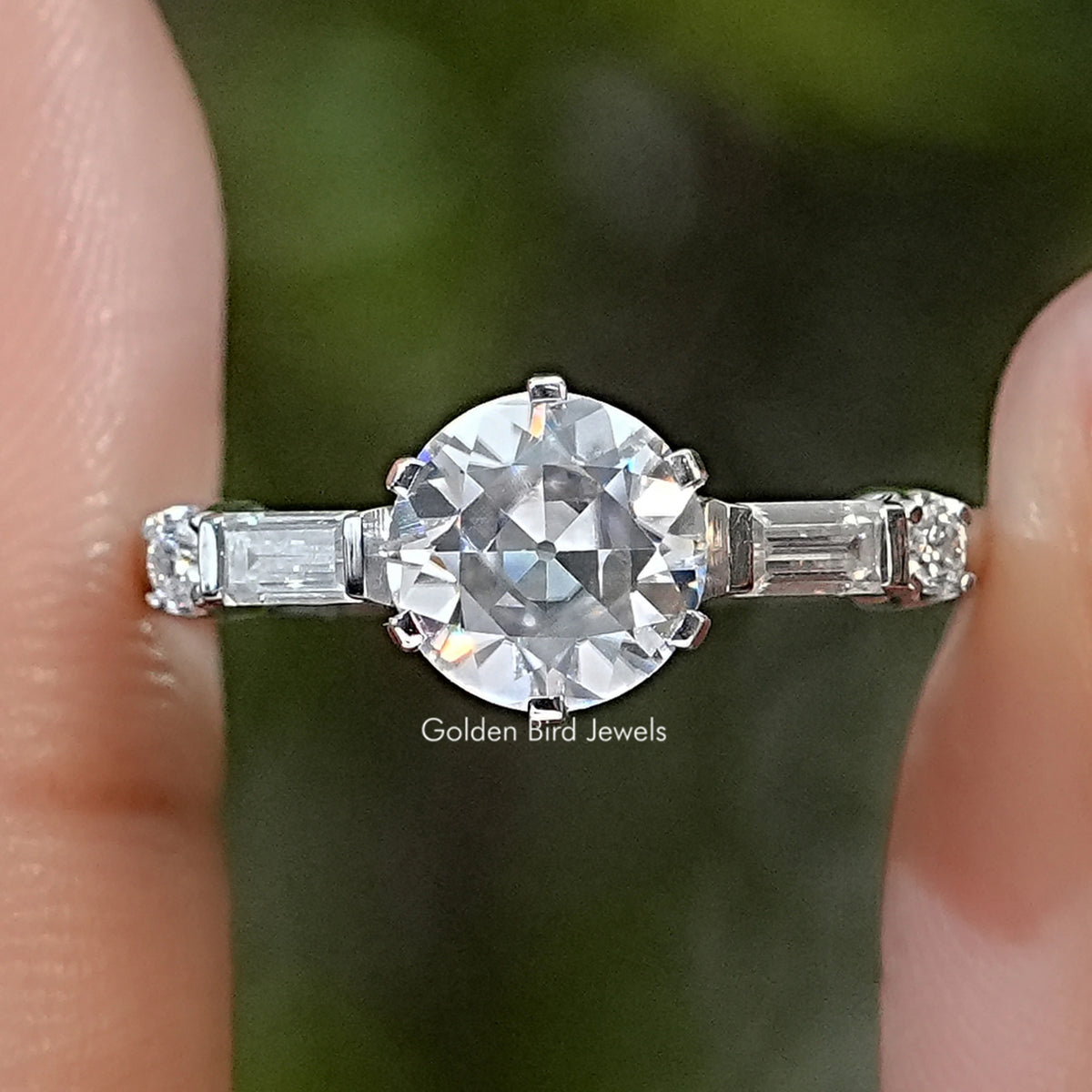 Sterling silver five-stone ring with a large round center stone and baguette side stones