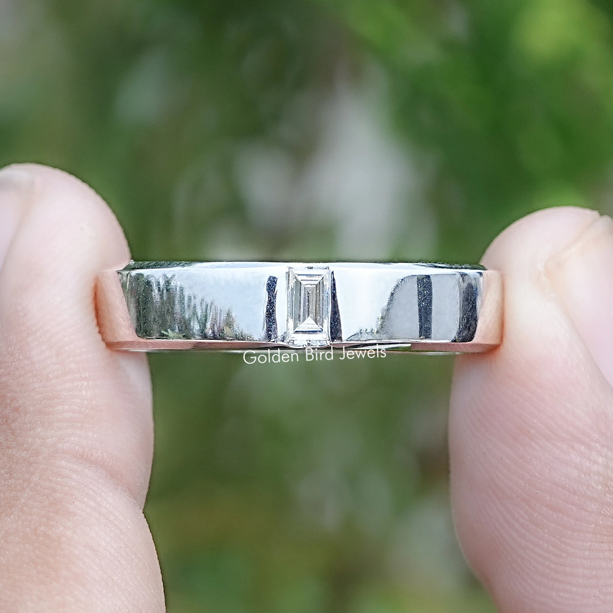Front view of Baguette Cut Moissanite Solitaire Engagement Ring in two fingers 