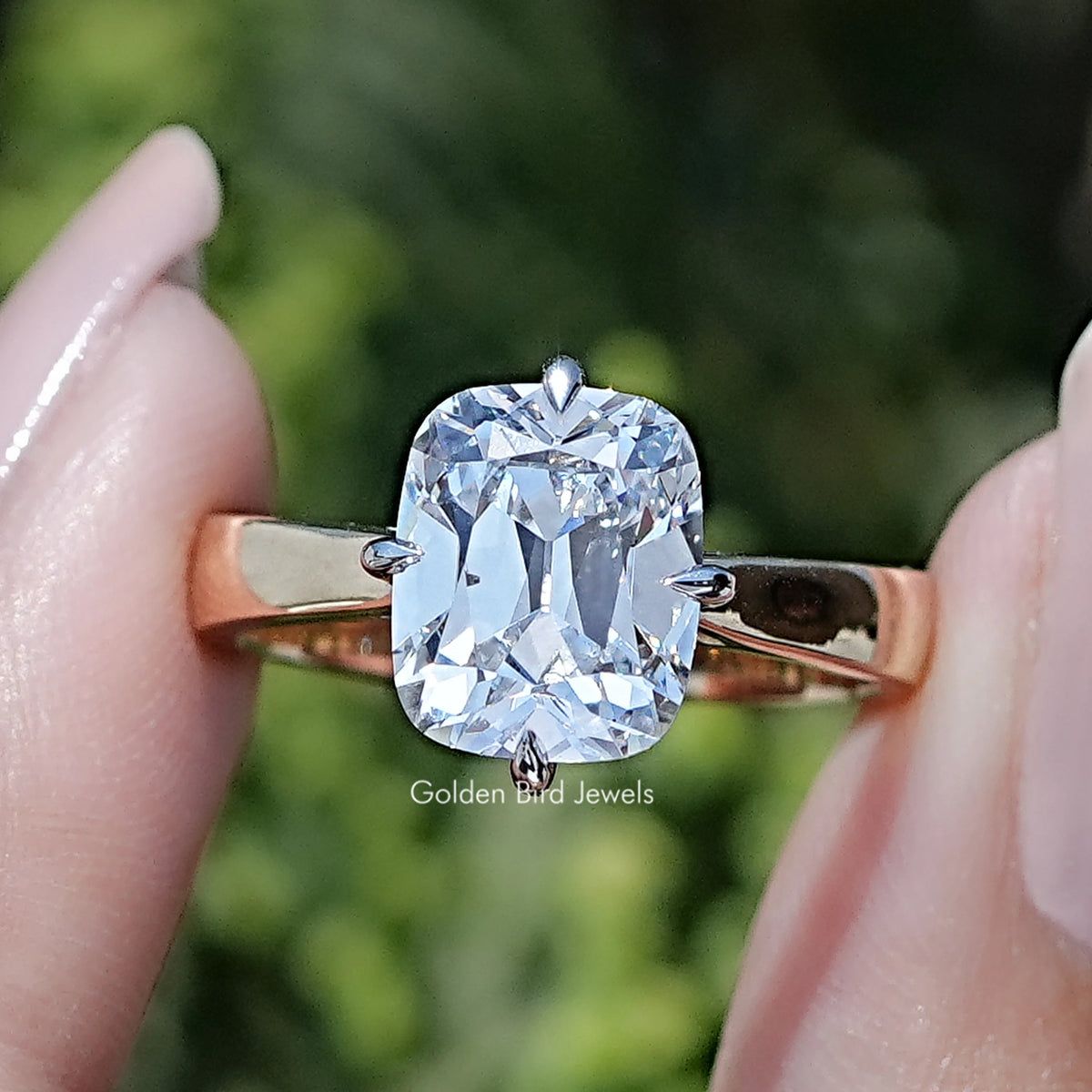 Front view of Old Mine Cushion Lab Diamond Engagement Ring in two fingers 