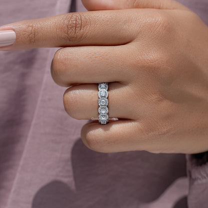 Round moissanite halo eternity band on a hand