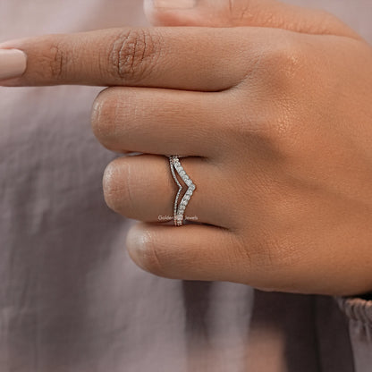 Silver chevron wedding band with round stones, angled side view