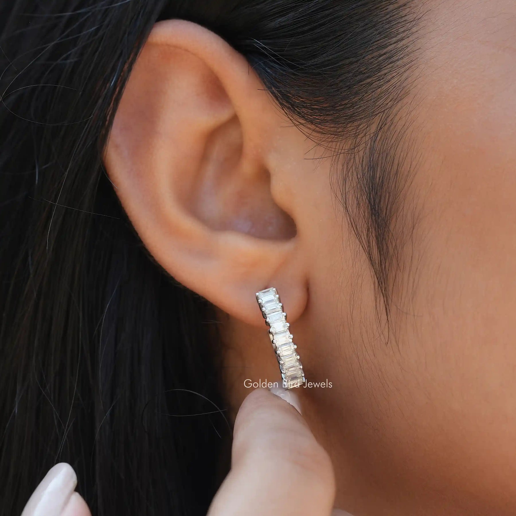 [In ear front view of baguette white gold moissanite earrings]-[Golden Bird Jewels]