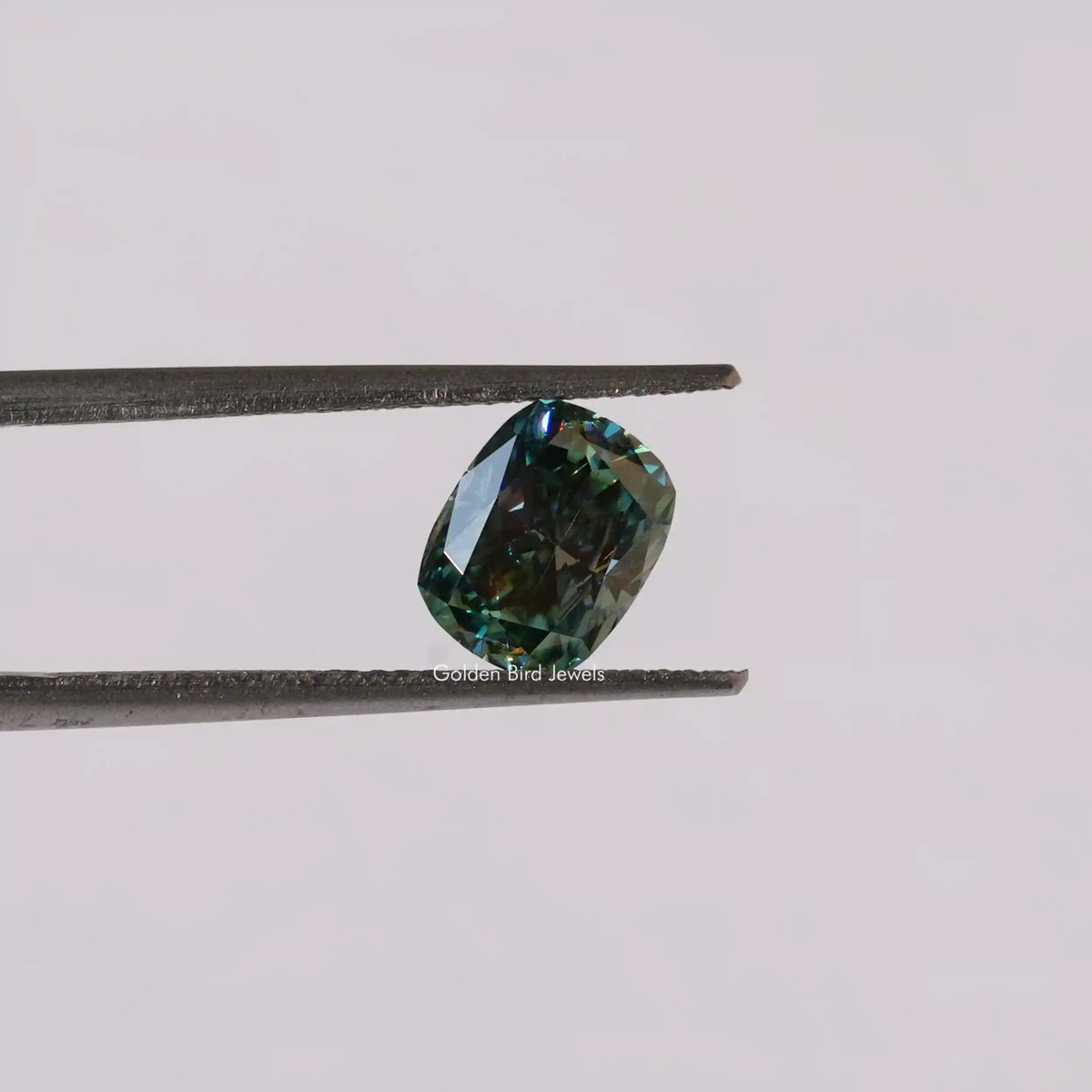 [In twizzer front view of blue green cushion cut loose stone]-[Golden Bird Jewels]