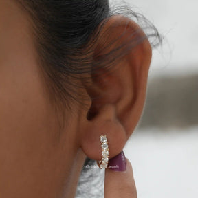 [In ear front view of round cut moissanite earrings in 14k yellow gold]-[Golden Bird Jewels]