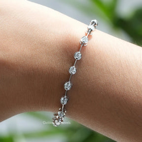 [On hand front view of round cut stunning moissanite bracelet in 14k white gold]-[Golden Bird Jewels]