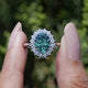 Front view of Green Oval Cut Moissanite Halo Engagement Ring