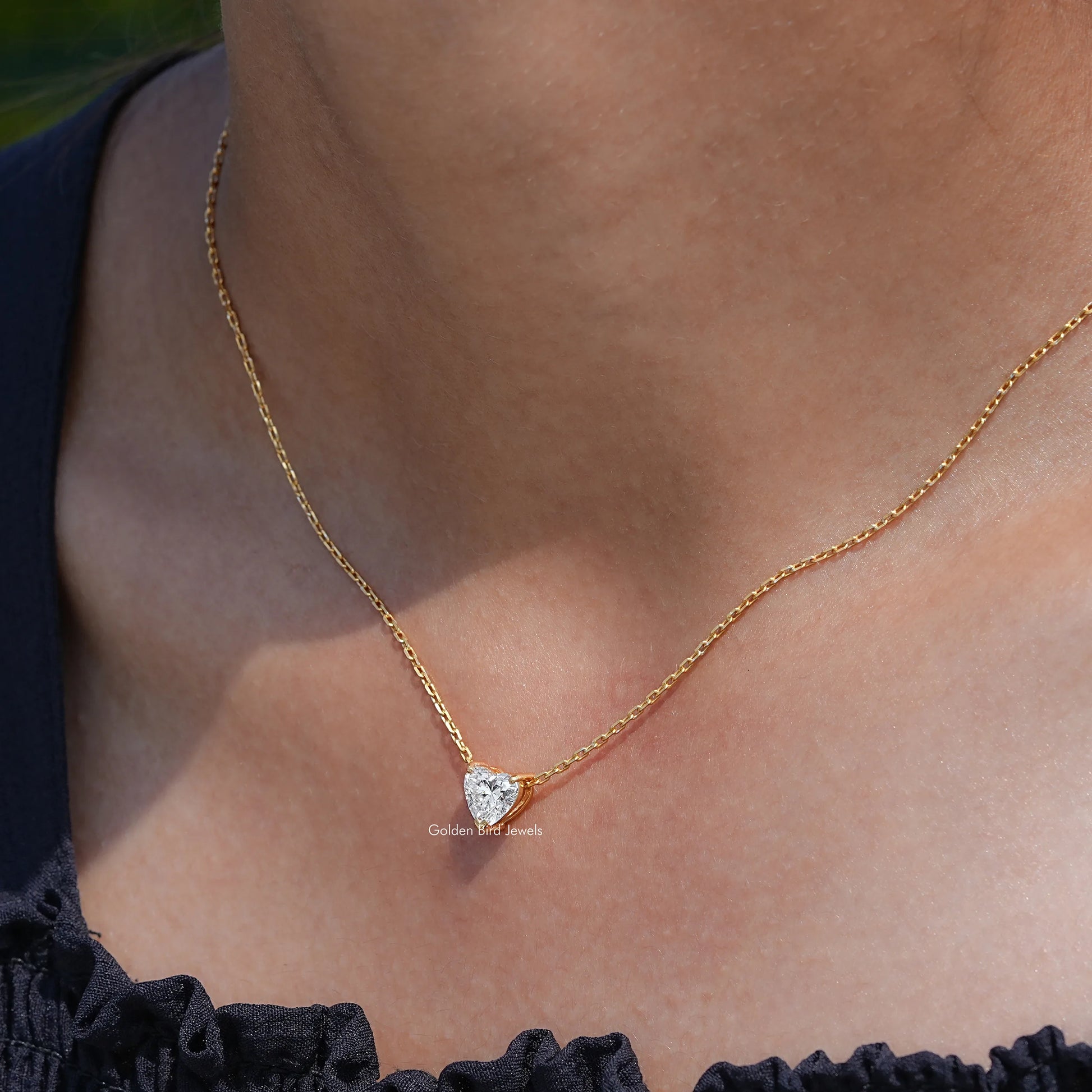 In neck view of heart cut diamond halo pendant