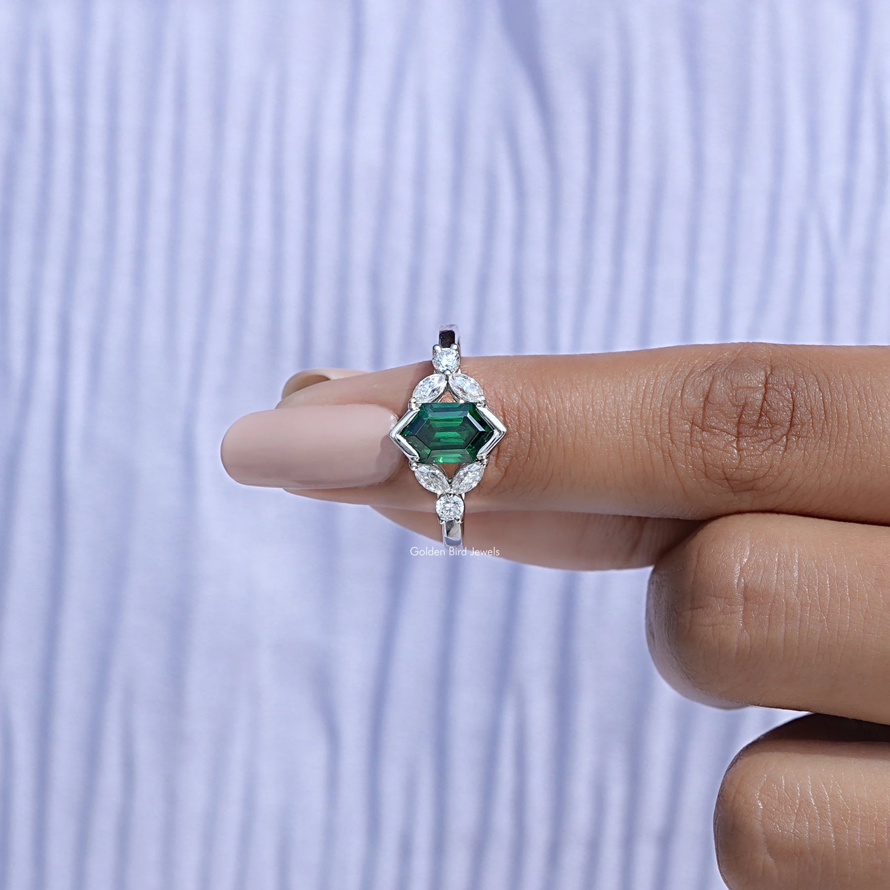 In finger front View of Green Emerald Hexagon Gemstone Ring In White Gold