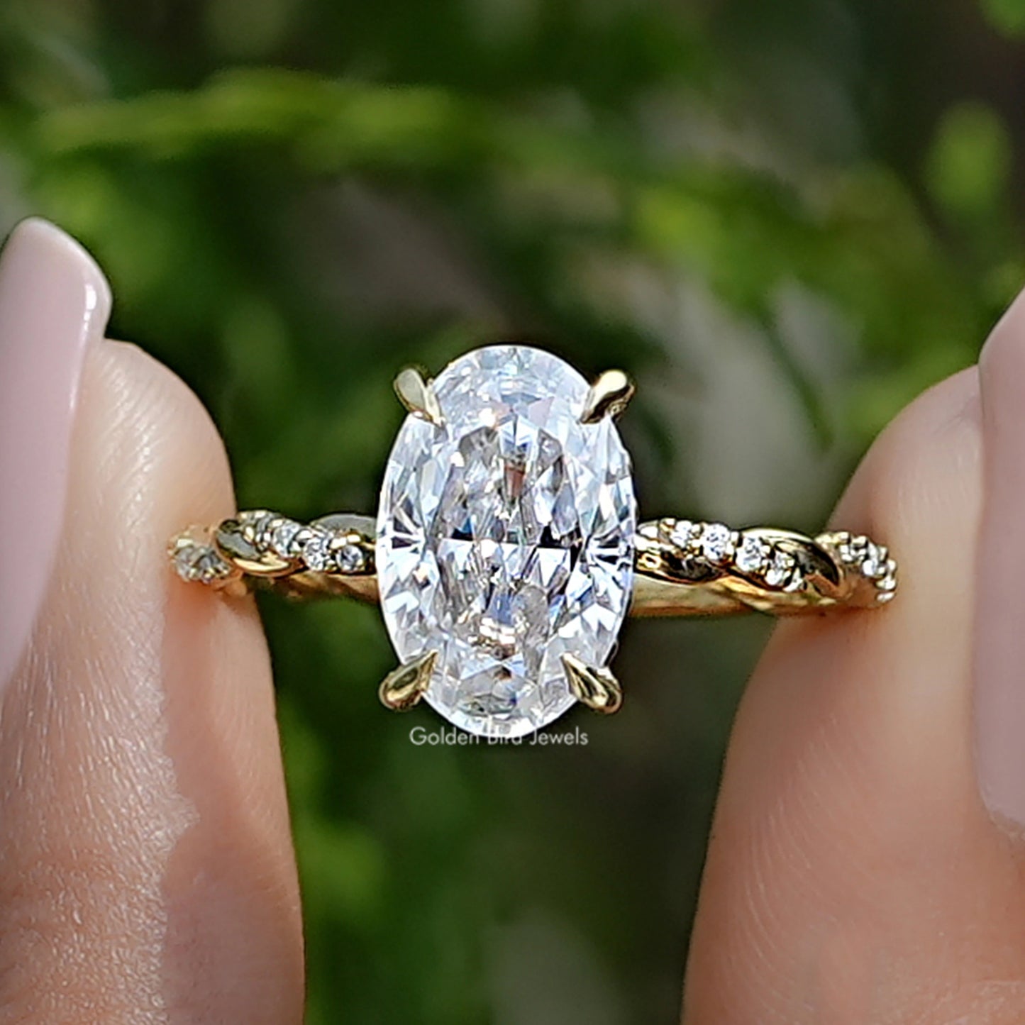 Front view of Crushed Ice Oval Moissanite Twist Shank Ring in two fingers 