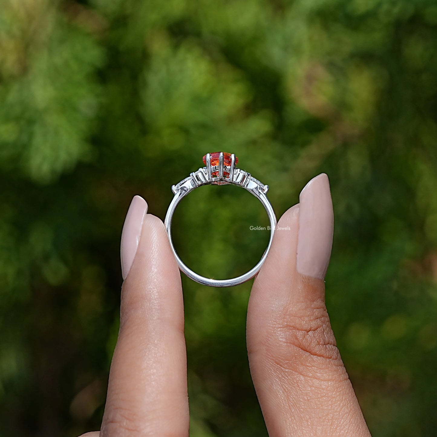 Back View of Kite Cut Gemstone Accent Ring In two fingers