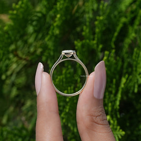 Back View of A White Gold Emerald Shaped Ring in a two fingers