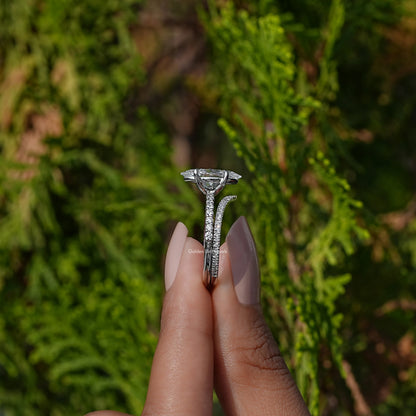 Side View of A Marquise Cut Bridal Ring Set in two fingers
