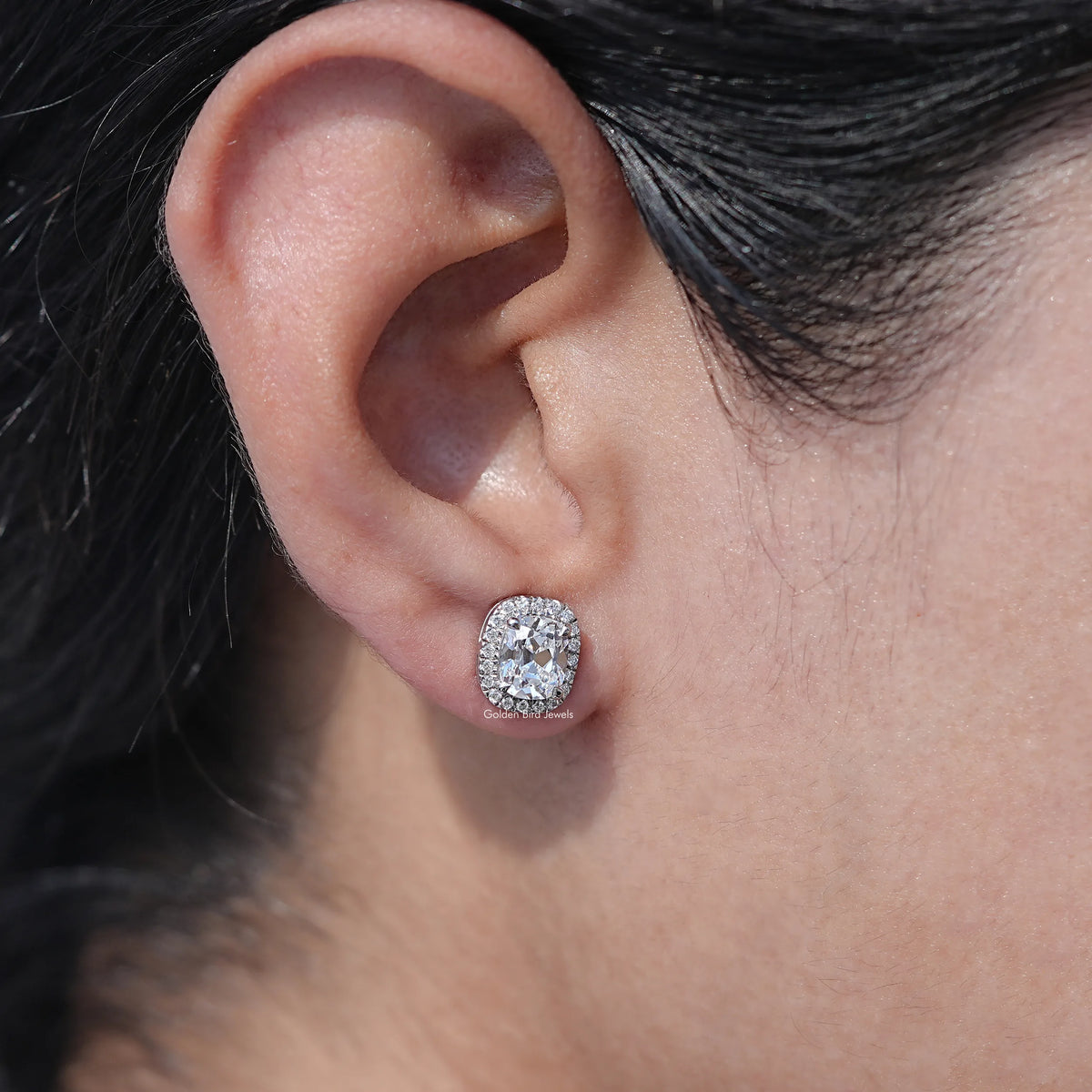 Front View of Elongated Old Mine Cushion Cut Halo Earrings In Women's ear