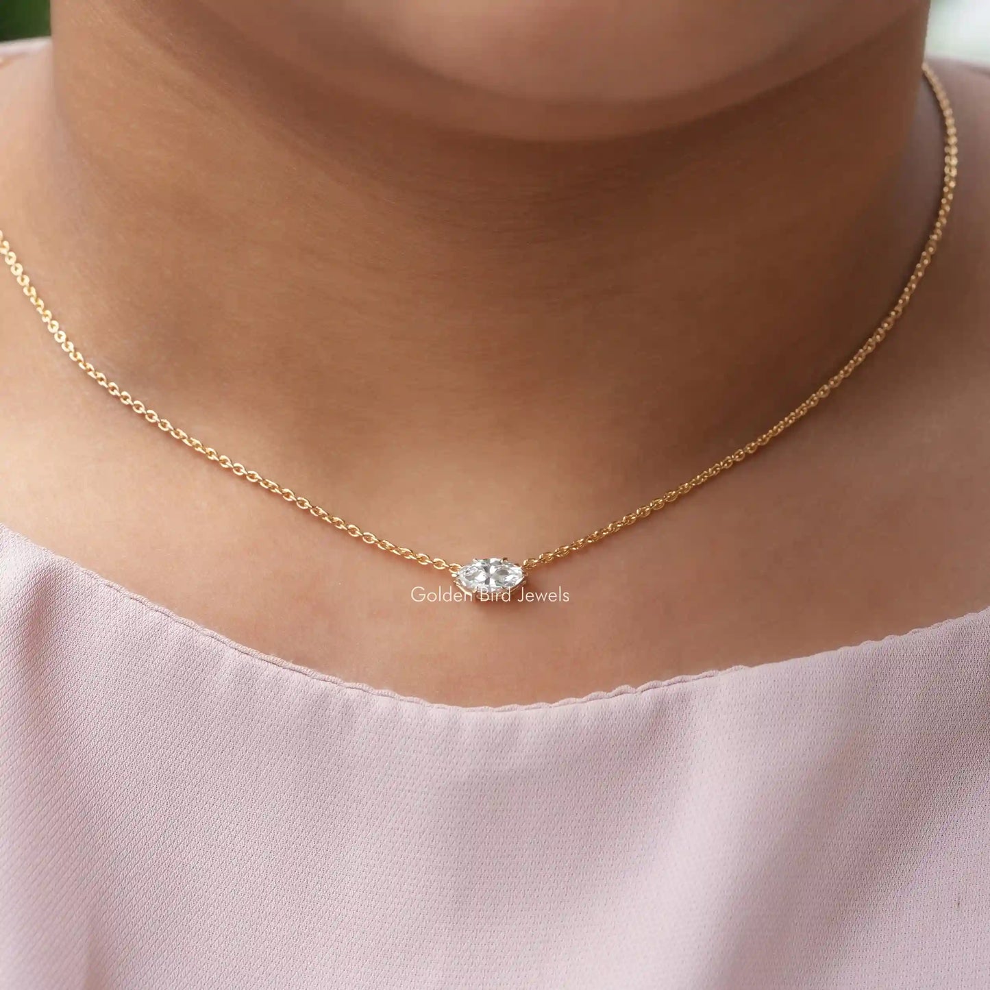 In neck front view of lab-grown diamond marquise solitaire pendant