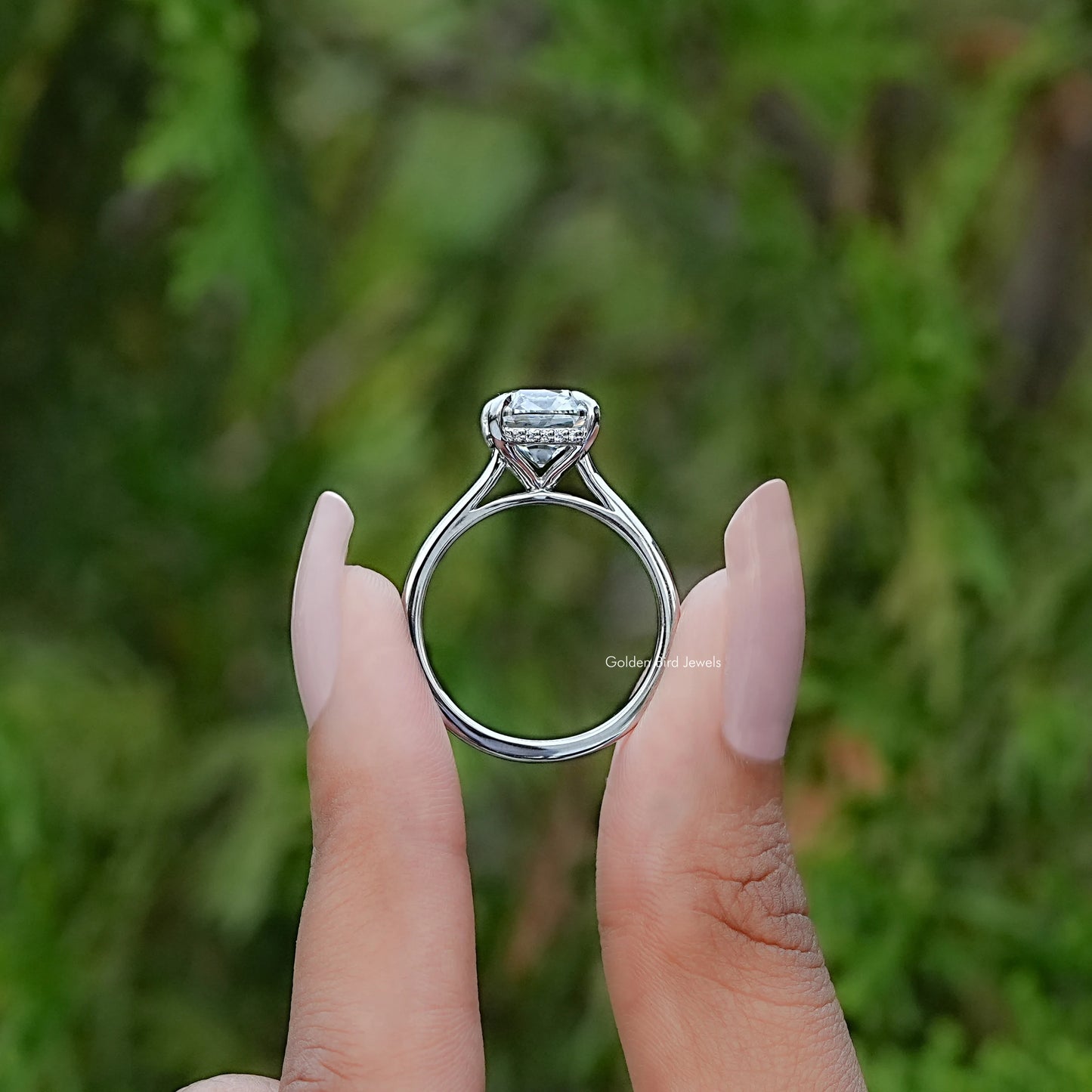 Back View of Old Mine Elongated Cushion Cut Diamond Ring In two fingers