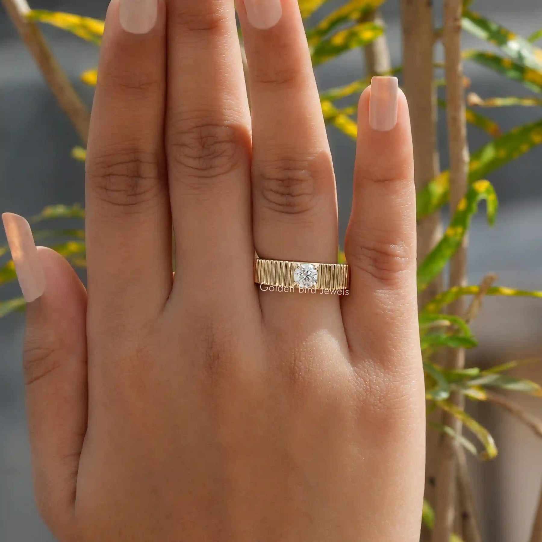 [In finger look of round cut solitaire engagement ring set in prongs]