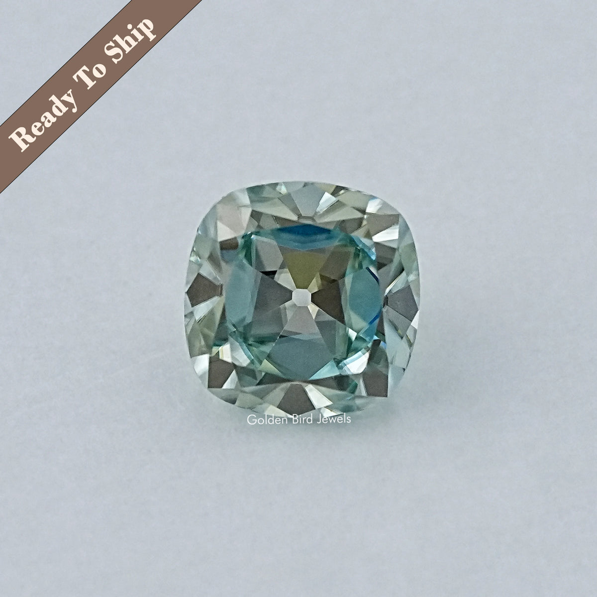 Light blue cushion-cut moissanite gemstone, faceted oval