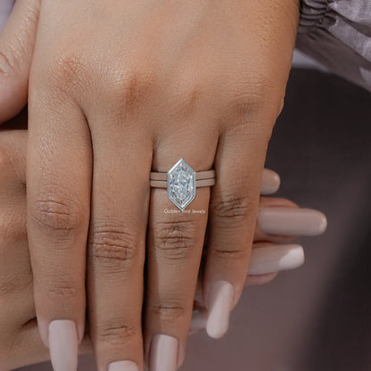 Marquise bezel ring set on hand, silver-tone band with raised center stone