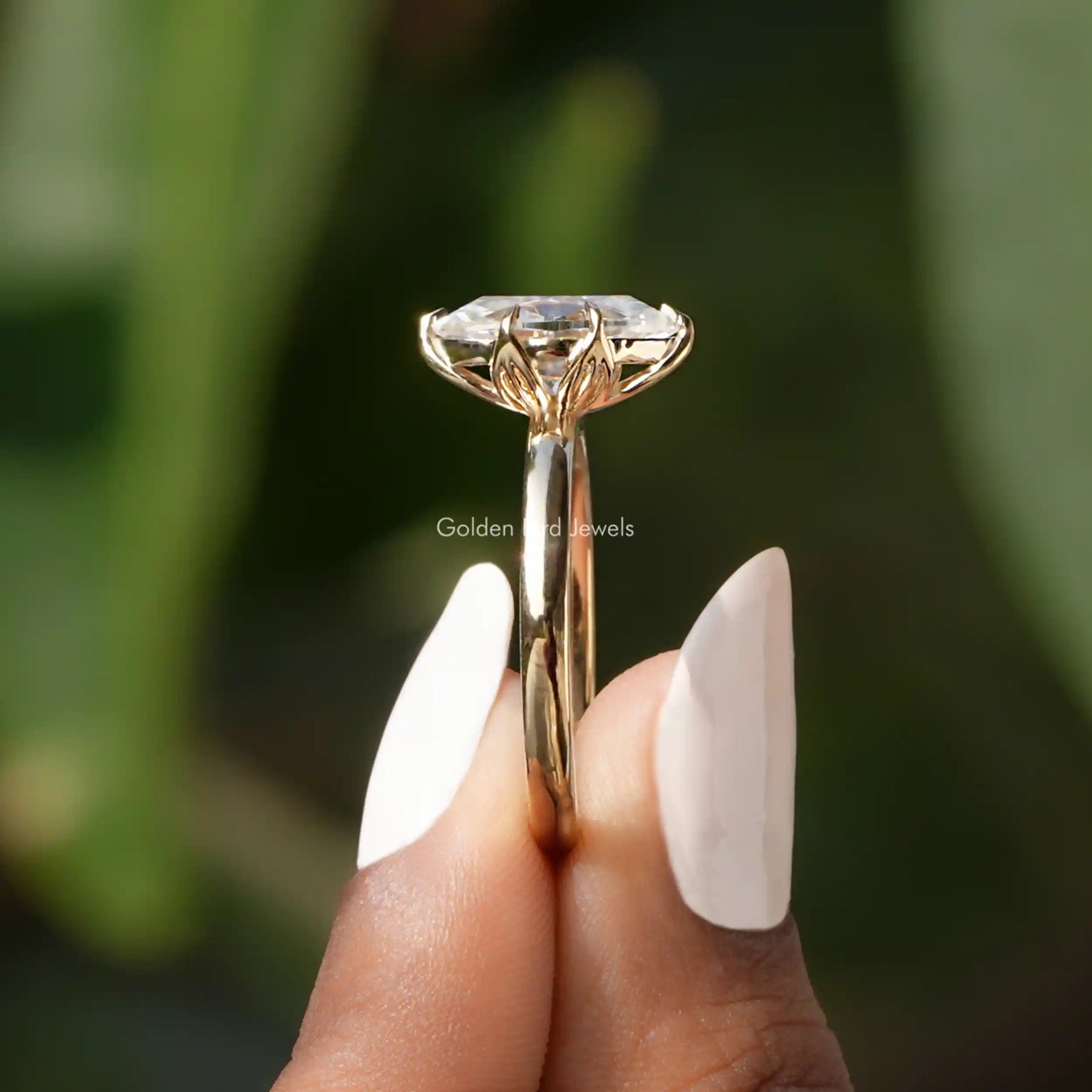 Side View of Marquise Cut Solitaire Engagement Ring In finger