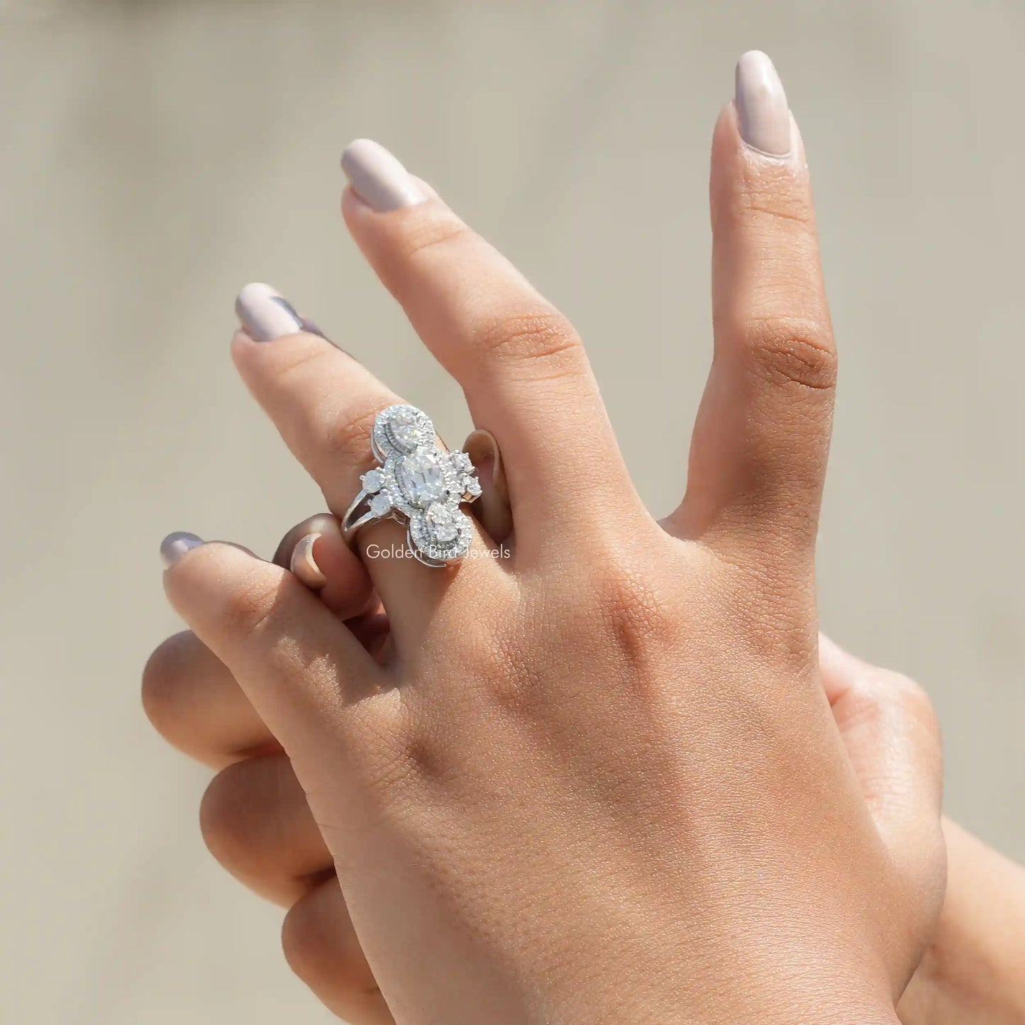 View of Old Mine Cushion And Pear Cut Moissanite Engagement Ring In Finger
