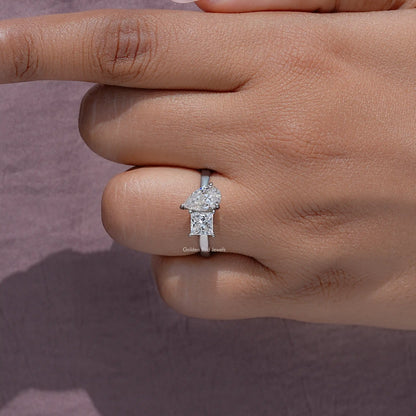 Moissanite toi et moi ring with prong-set stones and a slim silver band