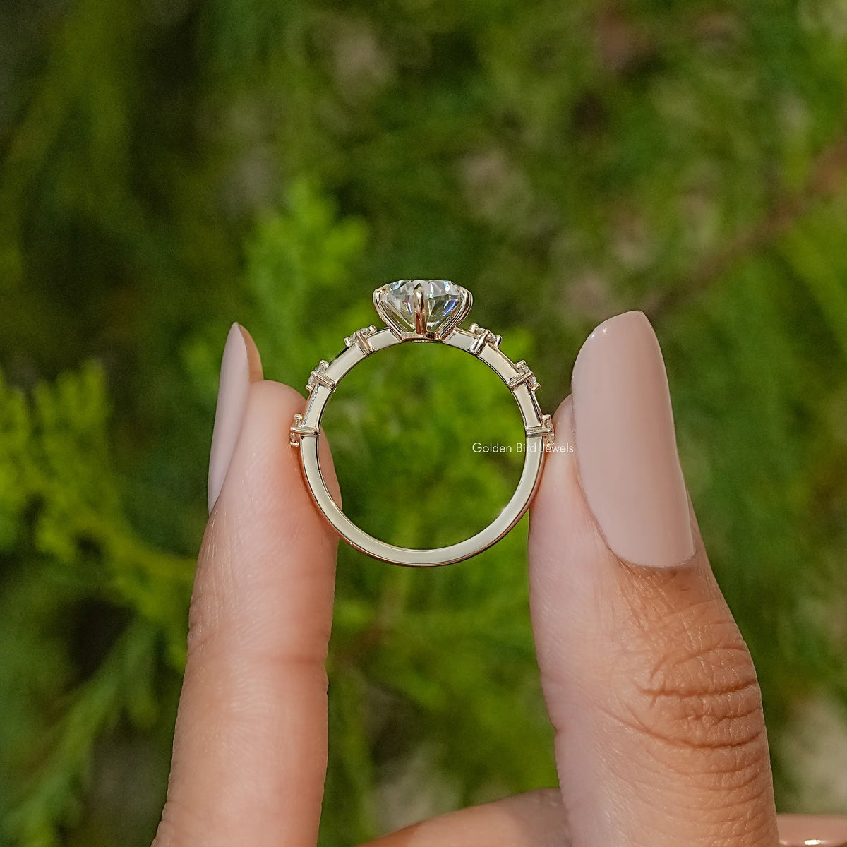 Oval-cut moissanite ring setting with prongs and oval center stone, side view