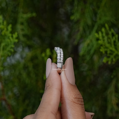 Narrow vertical view of curved eternity band with round clear stones, silver-tone