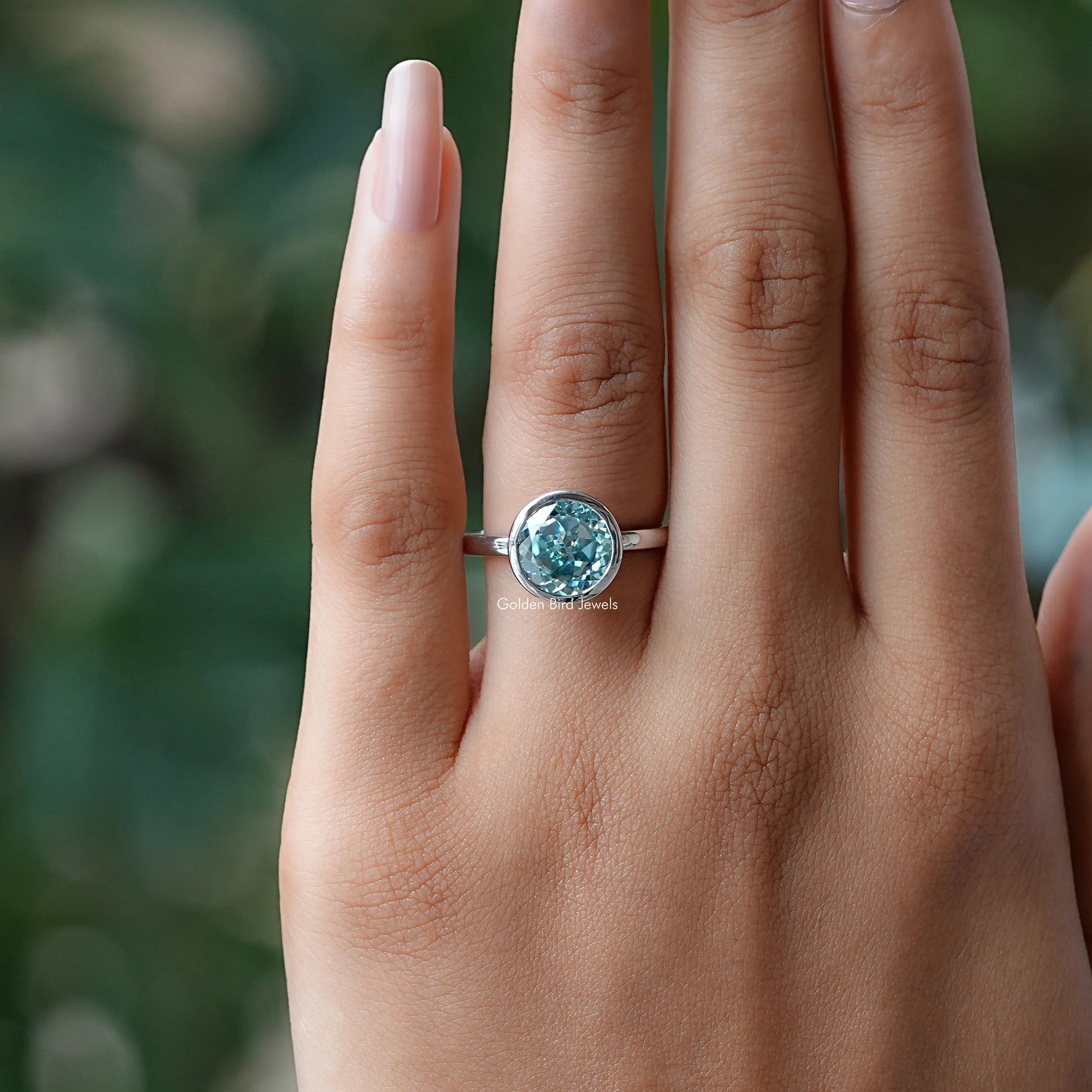 Close-Up View of Portuguese Cut Round Solitaire Ring In White Gold