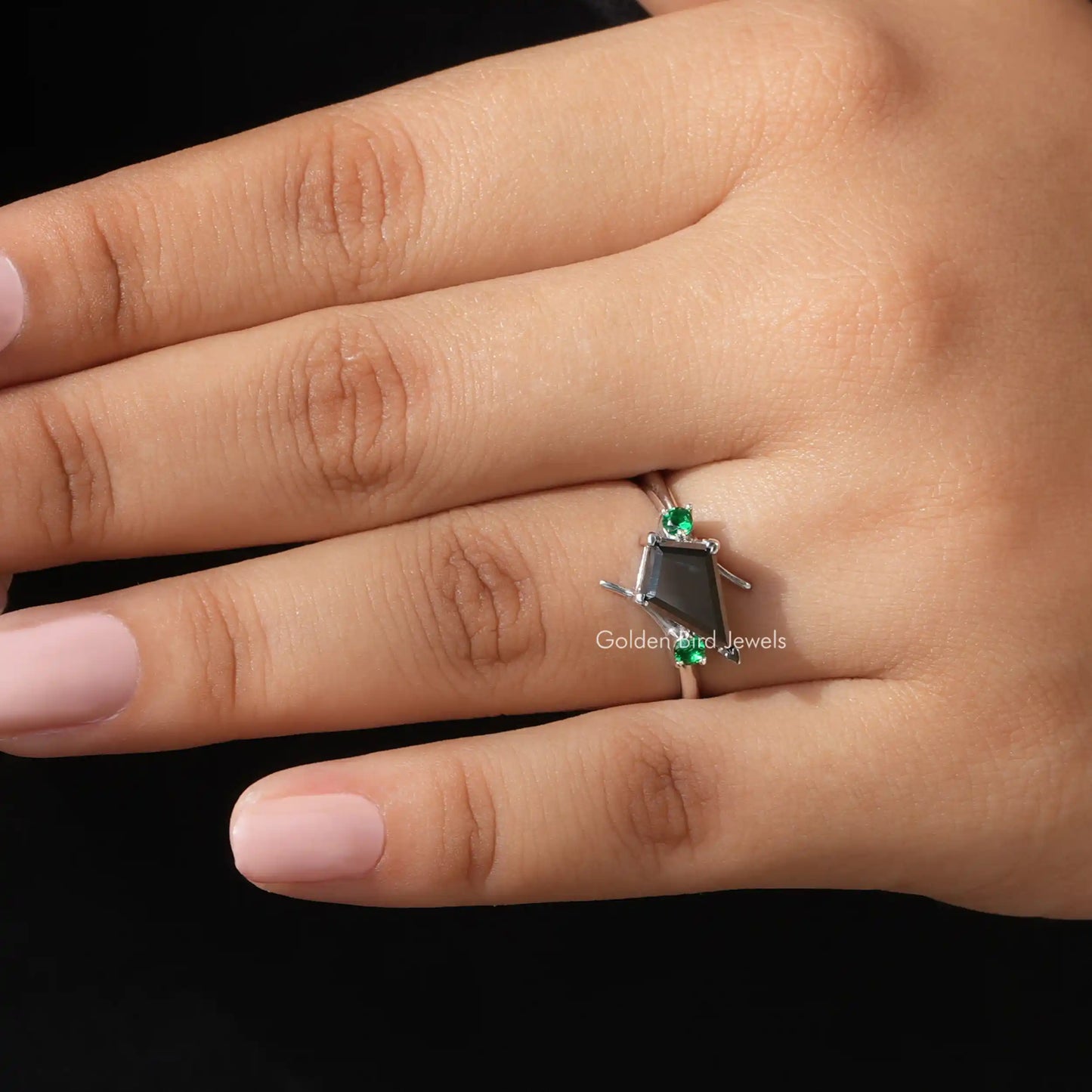 Close-Up View of Moissanite Kite And Round Cut Accent Stone Ring In Yellow Gold