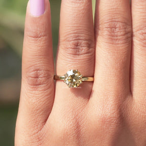 View of Round Cut Moissanite Solitaire Ring In Yellow Gold