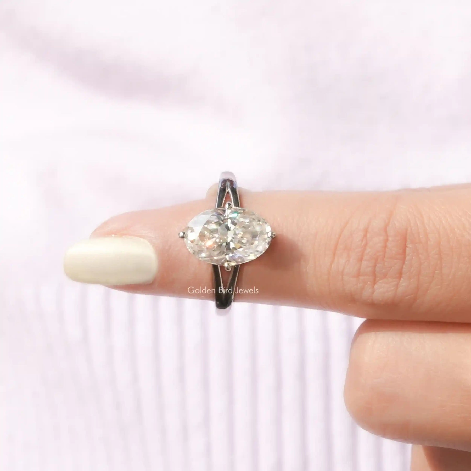 In finger front View of Crushed Ice Oval Cut Hidden Halo Ring