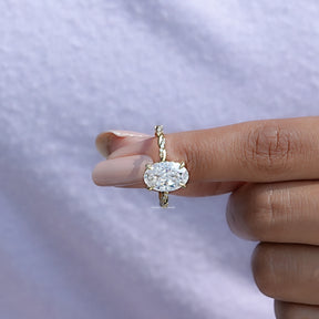 In finger front View of Oval Cut Moissanite Twist Shank Ring