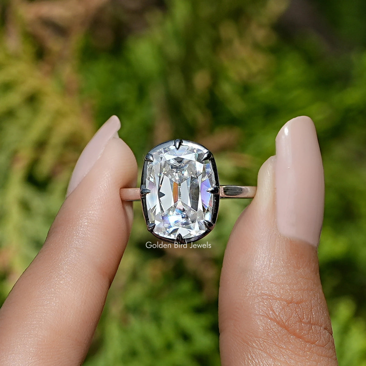 Front View of Elongated Old Mine Cushion Cut Moissanite Ring In two Fingers