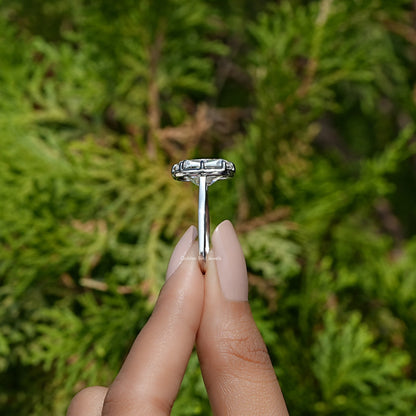 Side View of Moissanite Elongated Old Mine Cushion Cut Ring In two fingers