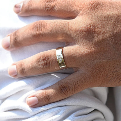 Detailed View Of Round And Marquise Cut Flush Set Ring In Yellow Gold