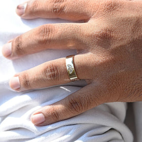 Detailed View Of Round And Marquise Cut Flush Set Ring In Yellow Gold