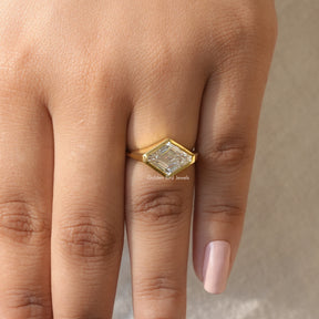 Detailed View Of Bezel Set Modified Lozenge Cut Moissanite Ring In Yellow Gold