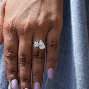 View of Old Mine Cushion And Old Mine Pear Cut Ring In Finger