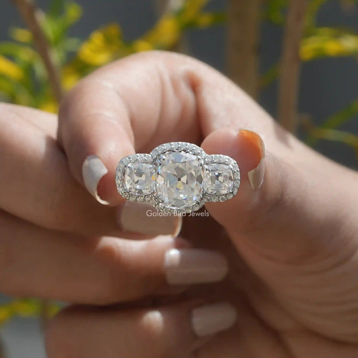 Front View of Old Mine Cushion Cut Moissanite Ring In two Fingers