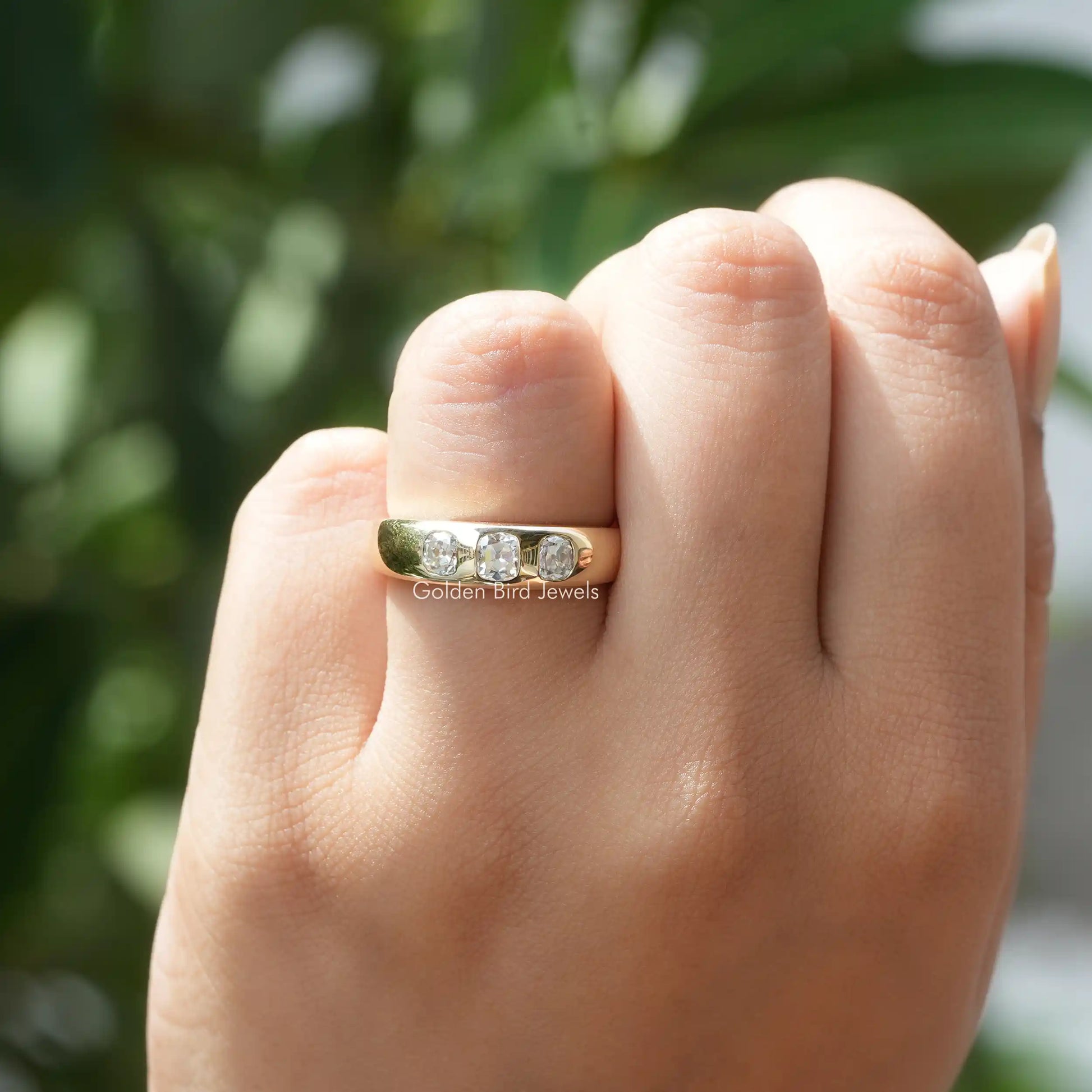 In hand showing a view of moissanite Ring	 		