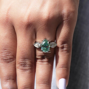Close-Up View of Old Mine Pear Cut Three Stone Moissanite Ring In White Gold