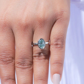 Detailed View of Oval Cut Moissanite Bezel Set Engagement Ring In White Gold
