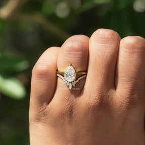 View of Colorless Pear Cut Moissanite Ring In Yellow Gold