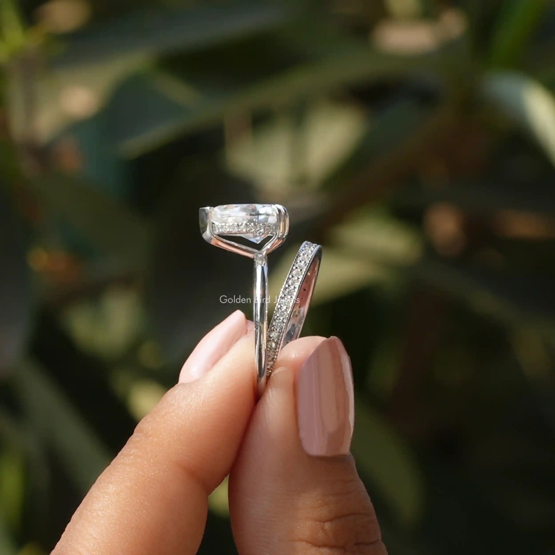 Side View of Hidden Halo Ring With Eternity Band In two fingers